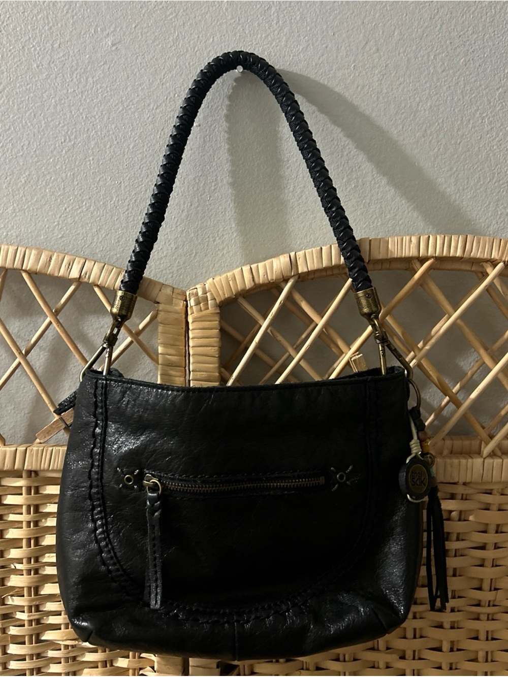 The Sak Indio Demi Leather Hobo Shoulder Bag Braided Strap Tassel Charm